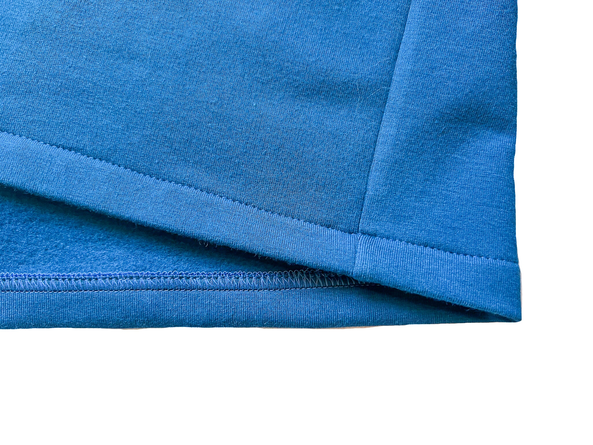 Close-up of a modern double-stitch hem showing two parallel lines of thread